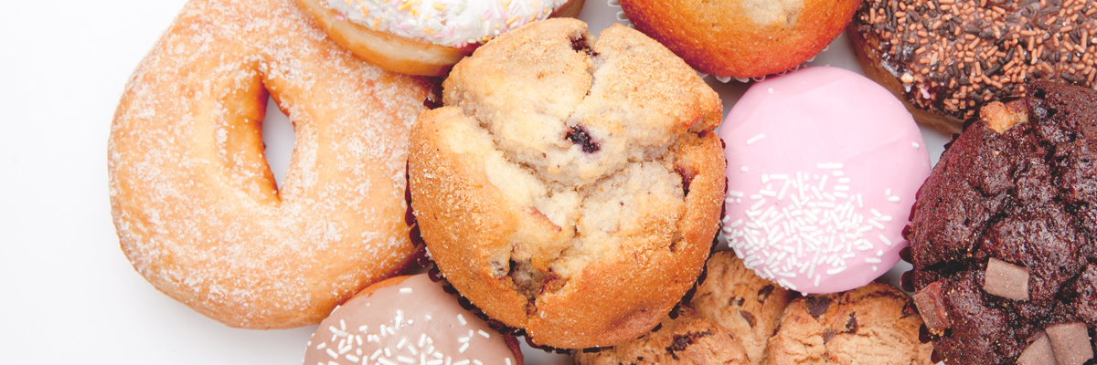 Close-up of Cakes, Muffins, and Doughnuts - Bakery - AAK