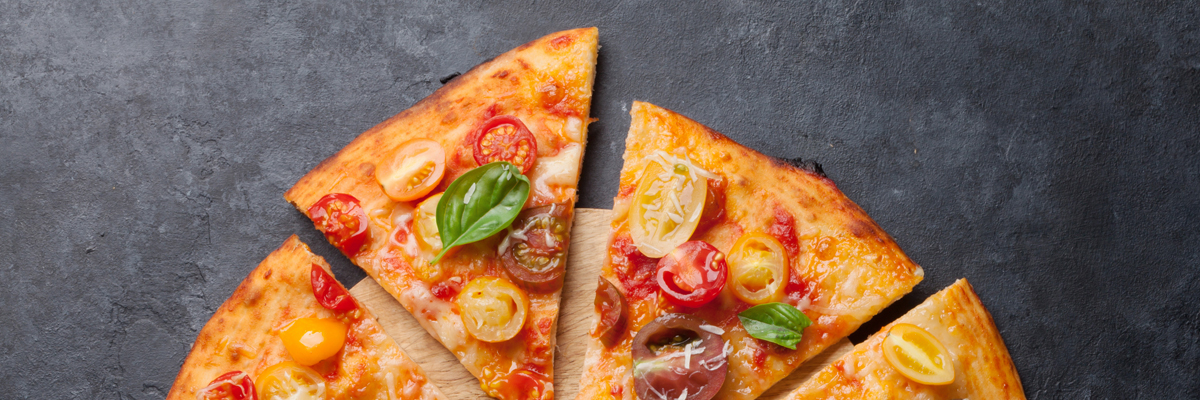 Delicious Pizza with Basil and Tomato on a Marble Table - Bakery - AAK